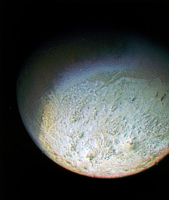 This color photo of Neptune's largest moon Triton was obtained by NASA's Voyager 2 probe on Aug. 24, 1989, from 330,000 miles away. The resolution is about 6.2 miles, sufficient to begin to show topographic detail. 