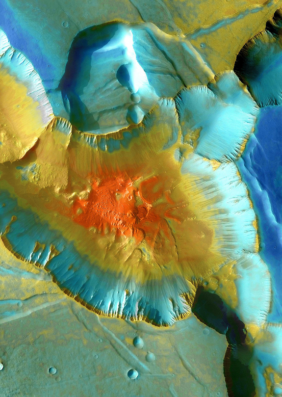 A false-color mosaic focuses on one junction in Noctis Labyrinthus where canyons meet to form a depression 4,000 meters (13,000 feet) deep. Dust (blue tints) lies on the upper surfaces, while rockier material (warmer colors) lies below. The pictures used to create this mosaic image were taken from April 2003 to September 2005 by the Thermal Emission Imaging System instrument on NASA's Mars Odyssey orbiter.