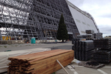 Reclaimed redwood from Hangar One at NASA's Ames Research Center is seen near the stripped down airship hangar at Moffett Field in California.