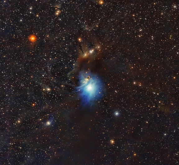 In this new image, a newly formed star (HD 97300) lights up the surrounding gas and dust, creating a reflection nebula — much like car headlights light up surrounding fog.