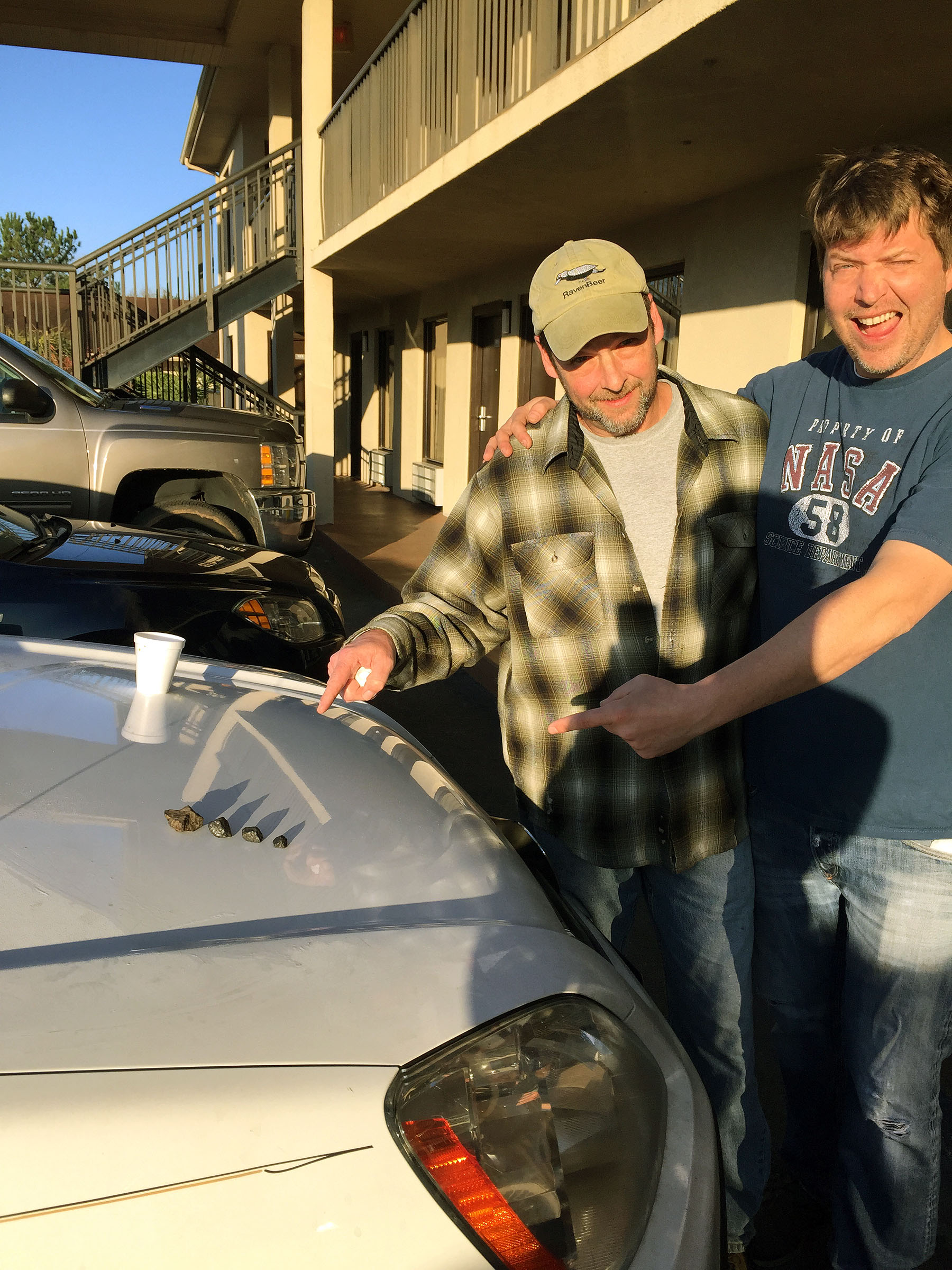 Larry Atkins and Mike Hankey with Four Meteorites 