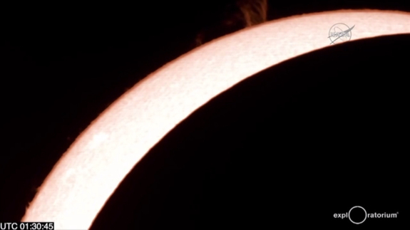 Great prominences on the sun are visible in this fiery telescope view of the total solar eclipse of March 8/9, 2016 as seen in a NASA webcast from Woleai Island in Micronesia arranged in partnership with the Exploratorium in California. 