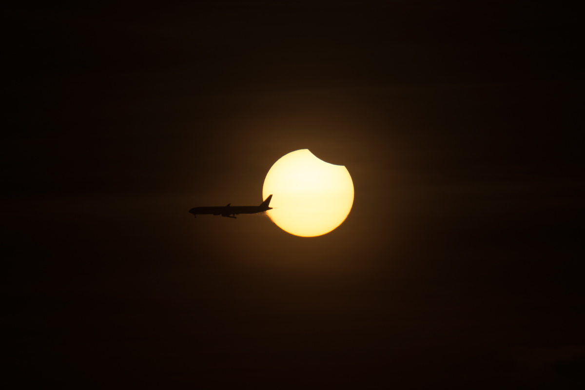 Plane Crosses Solar Eclipse of March 8, 2016