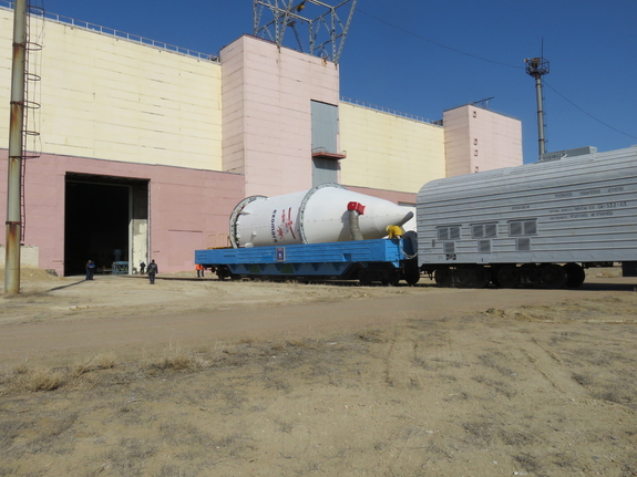 The ExoMars 2016 spacecraft (inside the fairing) and the Breeze-M upper stage of Russia’s Proton rocket are transported to an area at Kazakhstan’s Baikonur Cosmodrome to be integrated with the rest of the Proton launch vehicle. Photo taken on March 5, 2016.