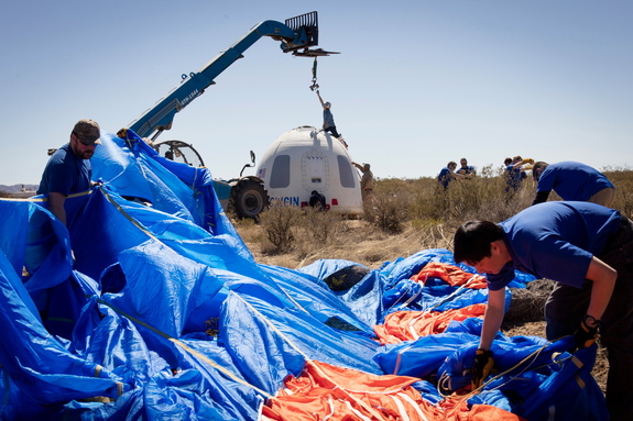 Blue Origin team members recover the crew capsule after its fifth successful flight and soft landing at its West Texas launch site on April 2, 2016.