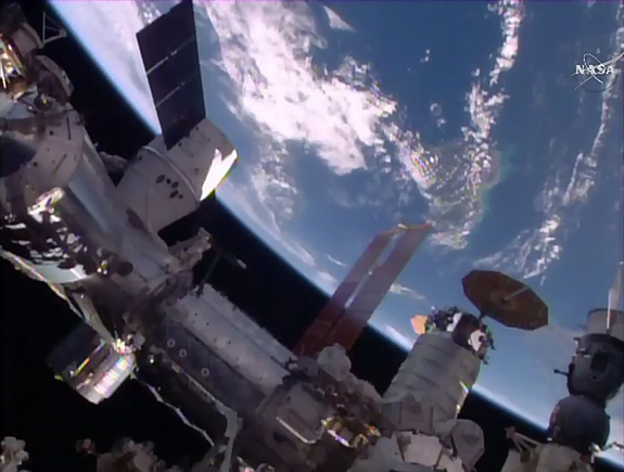 This unprecedented view shows SpaceX's Dragon cargo ship (left), Orbital ATK's Cygnus ship at center and Russia's Progress cargo ship at far right after the Dragon's docking on April 10, 2016. It's the first time two private U.S. cargo ships have been together at the station.