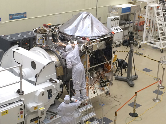 The OSIRIS-REx spacecraft, built at Lockheed Martin's Littleton, Colorado campus, will collect a sample from asteroid Bennu and return it to Earth. The spacecraft is kept in a clean room to reduce the risk of contaminating the asteroid sample with material from Earth. 