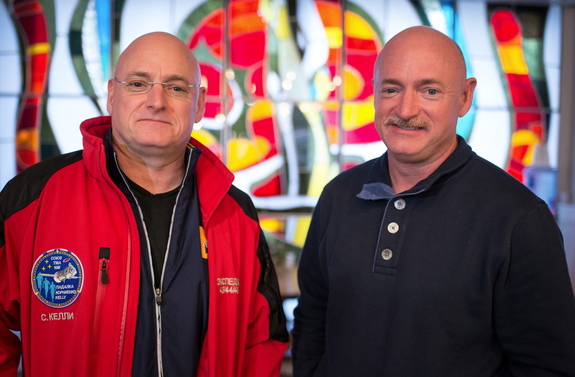 Identical twins Scott (left) and Mark Kelly pose for a photo at the Cosmonaut Hotel in Baikonur, Kazakhstan, on March 26, 2015, one day before Scott launched on a yearlong mission to the International Space Station.