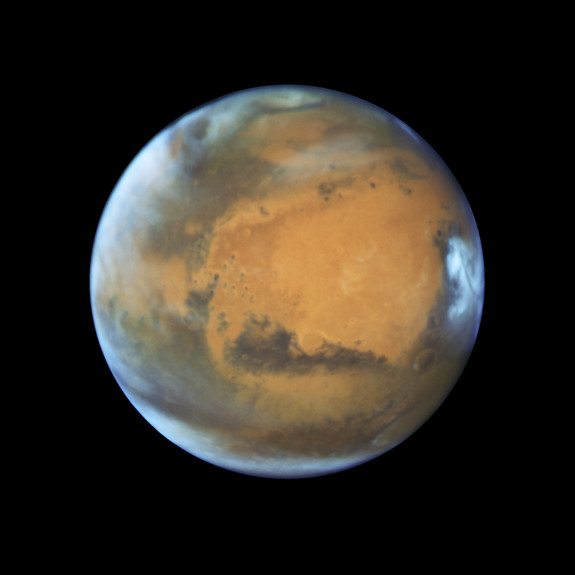 This global view of Mars was captured by the Hubble Space Telescope on May 12, 2016 ahead of the planet's arrival at opposition on May 22. The wide view lets scientists observe how climate impacts the entire planet. 