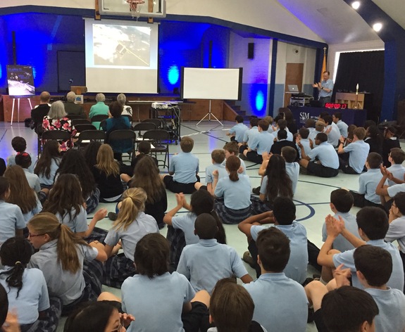 St. Thomas More students watch their cubesat deploy from the space station.