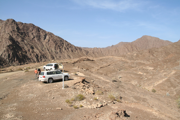 Scientists survey the peridotite landscape and obtaining access to deep wells drilled into peridotite.