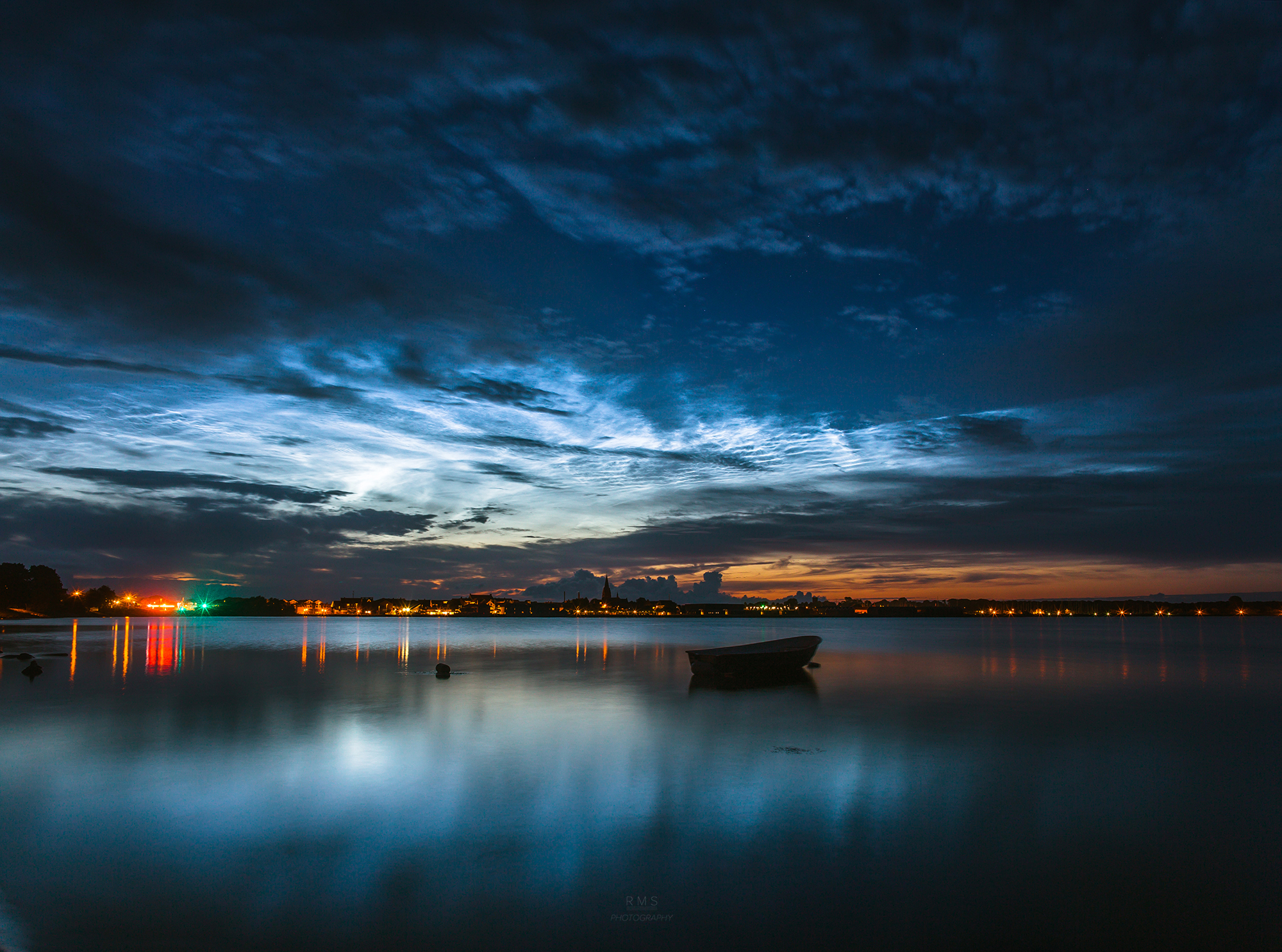 Shining Silver-Blue Clouds Captured in Night Sky Photo